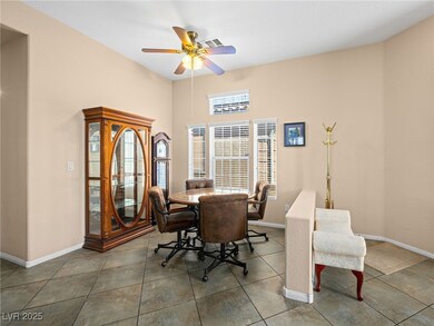 Dining area featuring tile patterned floors, a cei