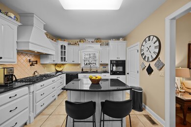 Kitchen featuring premium range hood, a kitchen is