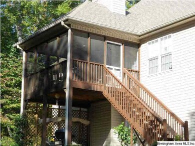 Nice screened in back deck with a concrete patio u