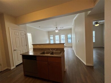 Kitchen featuring a sink, a ceiling fan, ornament
