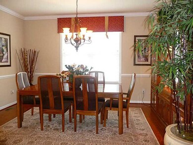 Dining Room. Chair rail, crown molding, hardwood f