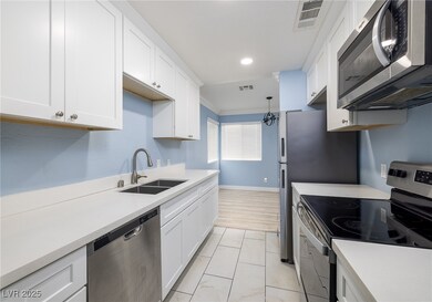 Kitchen includes stainless steel appliances white