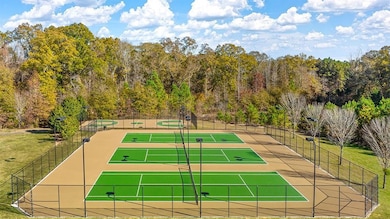 View of sport court featuring fence