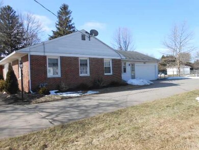Exterior Front with view of garage on north side