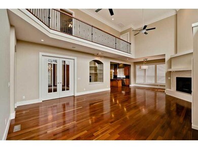Living Room. Another view.  Note the lighted display area, french doors to formal dining.
