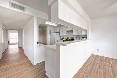 Breakfast bar separates the kitchen and dining are