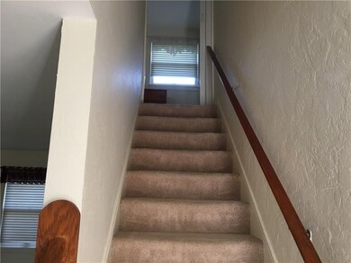 The staircase leads to the second floor.