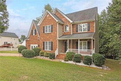 View of front of house with a front lawn and cover