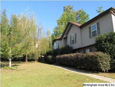 Side view of home with front yard