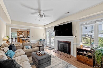 Living room with light hardwood / wood-style floor