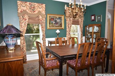 Floor Length Windows, 9 Foot Smooth Ceilings, Crown Molding and Hardwood Flooring