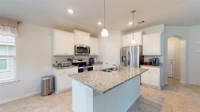 Kitchen featuring appliances with stainless steel
