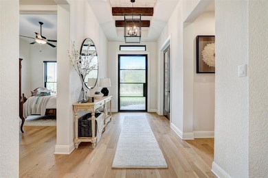 Foyer featuring light wood-style floors, a ceilin