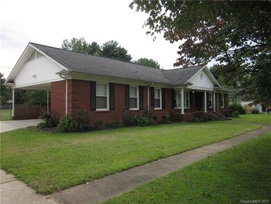 Classic brick with covered front porch and side en
