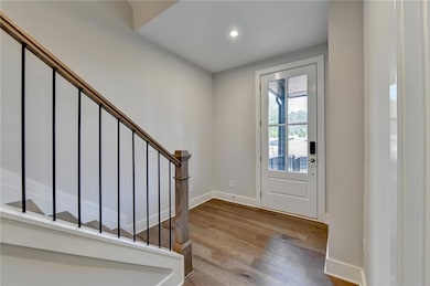 Foyer entrance featuring wood-type flooring
