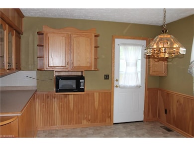 The kitchen door opens to a stamped concrete patio
