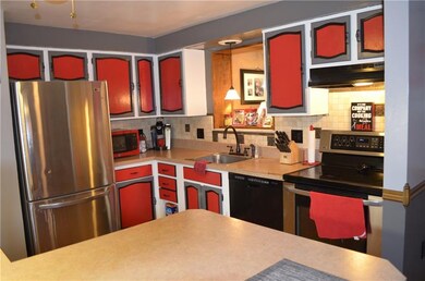 Kitchen features newer appliance that stay with th