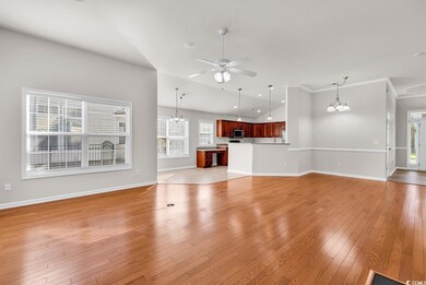 Unfurnished living room with ceiling fan with nota