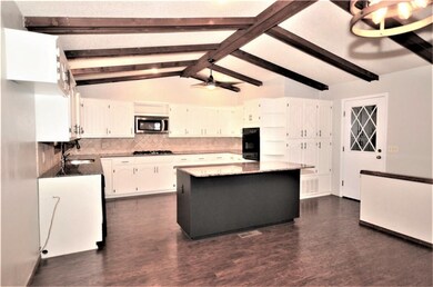 Another view of the kitchen from the dining area.