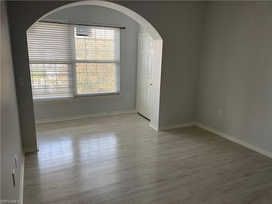 Spare room featuring light hardwood / wood-style f