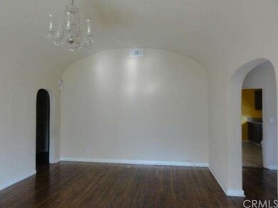 Living room with arched ceiling and door ways