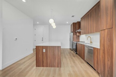 Kitchen with stainless steel appliances, modern c