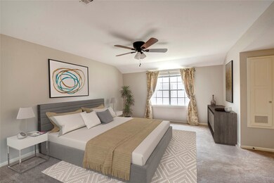 Generous master bedroom has view of the front cour