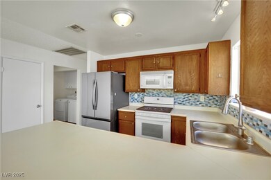Kitchen featuring white appliances, independent wa