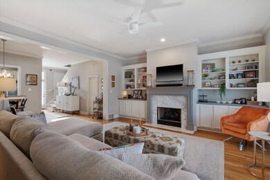 Living room featuring crown molding, a premium fir