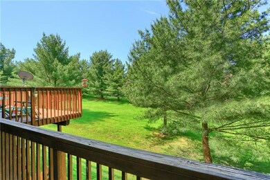 The rear features a back deck and lots of green sp