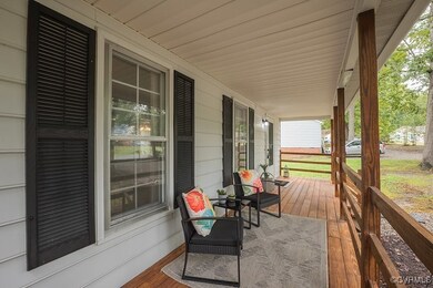 Wooden terrace featuring a porch
