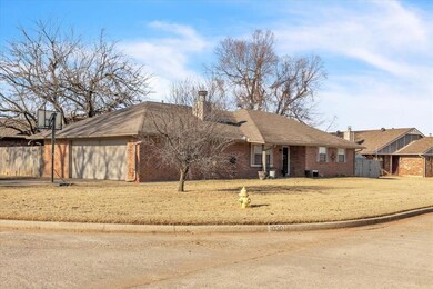 Ranch-style house with a front yard and a garage