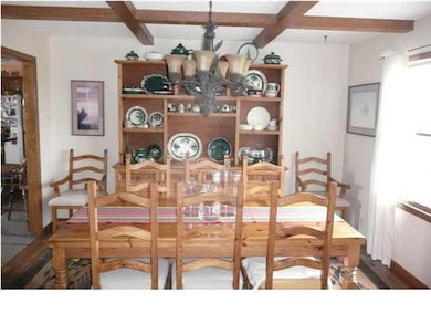 Formal diningroom with beamed ceiling!