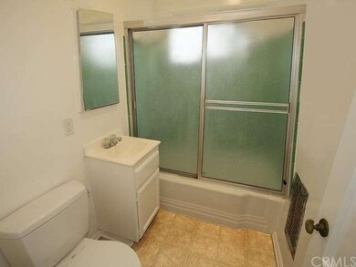 Full bathroom with shower over tub, sink and toile
