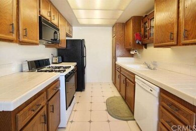Full view of kitchen, lots of cabinets and counter