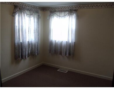 Bedroom. 1 of 2 upper bedrooms.  Carpeting less th