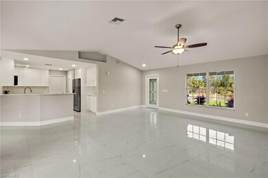 Unfurnished living room with marble finish floor, 