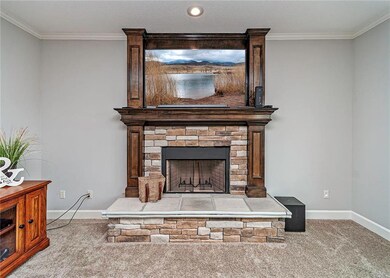 Great room centered on the gorgeous fireplace acce
