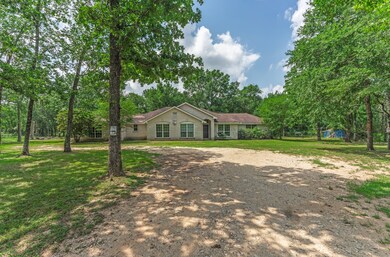 This photo shows a charming single-story home surr