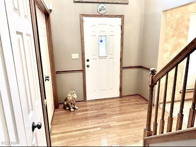 Entryway featuring light wood-style flooring and baseboards