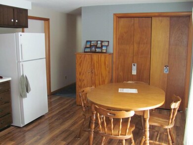 Eat-in kitchen washer and dryer closet.
