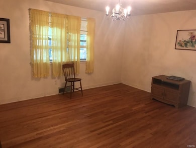 Master bedroom with newly refinished hardwoods.