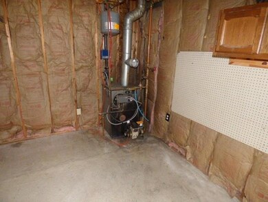 Oil fired boiler in garage.