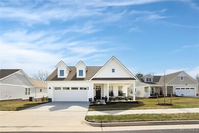 View of front of property featuring a front lawn,