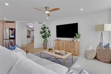 Living area featuring recessed lighting, light wood-type flooring, and a ceiling fan