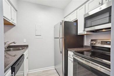 Kitchen w/new Refrig,  Microwave, and Range/Oven.