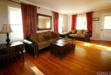 Living room with original hardwood floors.