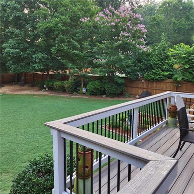 Wooden terrace featuring a fenced backyard