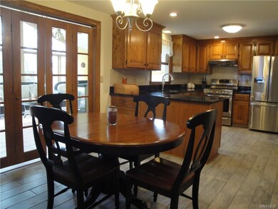 Large, Open Kitchen.  French Doors Lead to Florida