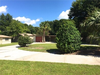 Back Yard w/Single Car Garage and Double Carport